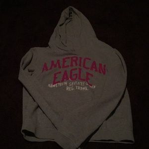 A pink/gray/white sweat shirt by American eagle